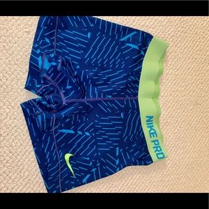 Blue patterned Nike Pros